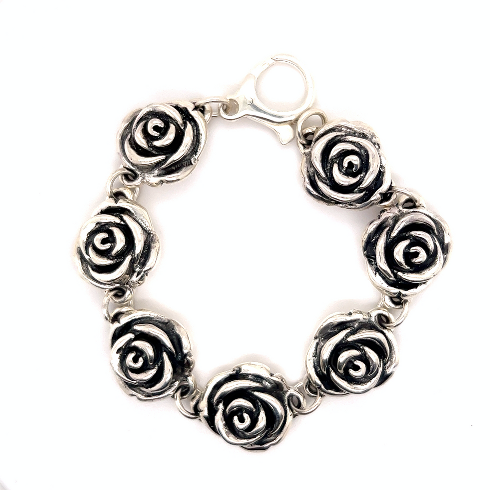 A statement piece, Super Silver Chic Link Rose Bracelet with intricate roses linked together.