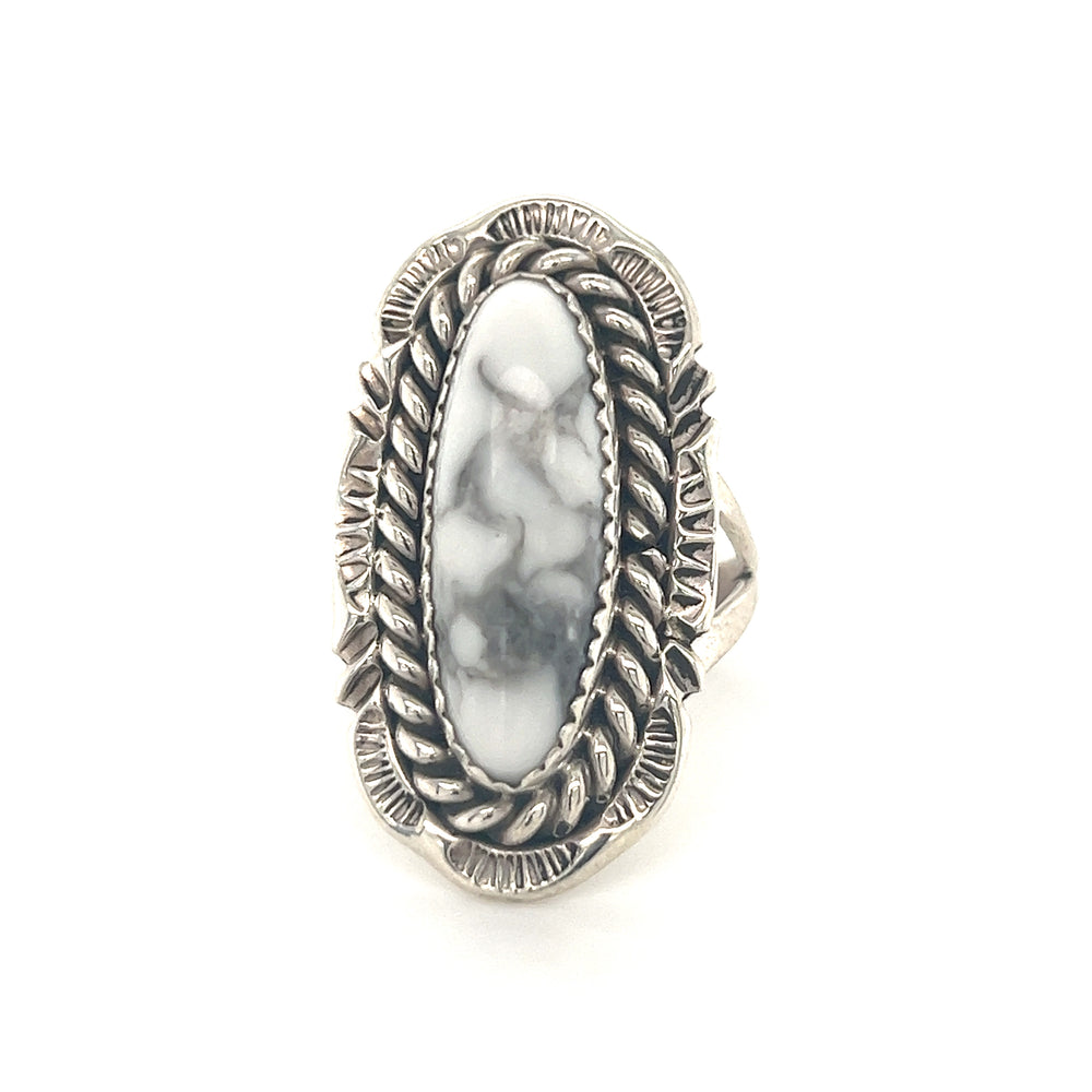 A sterling silver ring with a Striking White Buffalo Turquoise stone.