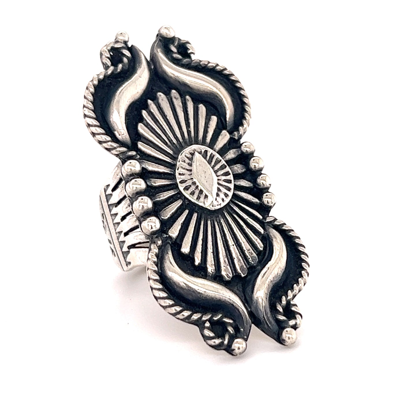 
                  
                    A silver Super Silver Extravagant Native American Shield Ring with a sunburst design, reflecting the rich cultural heritage of southwest tribes.
                  
                