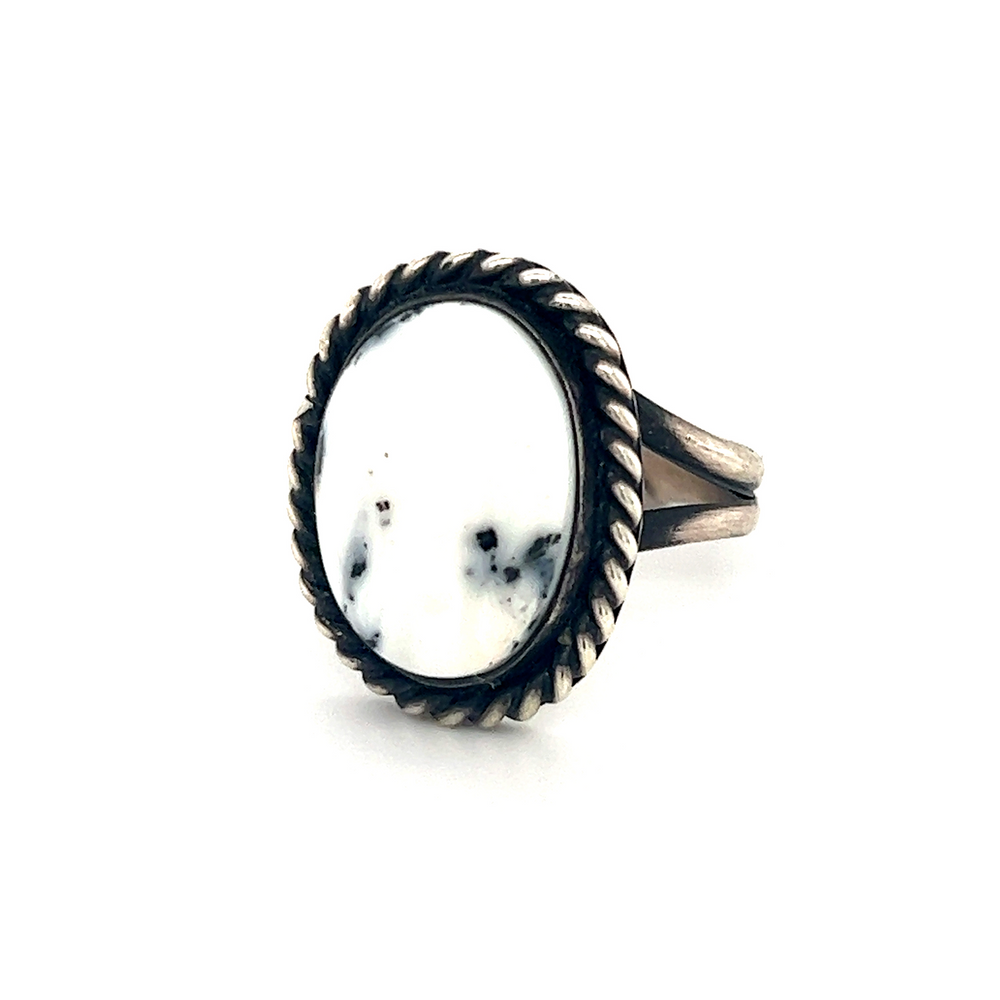 
                  
                    A Unique White Buffalo Turquoise Ring with a white stone in the center, inspired by Native American culture.
                  
                