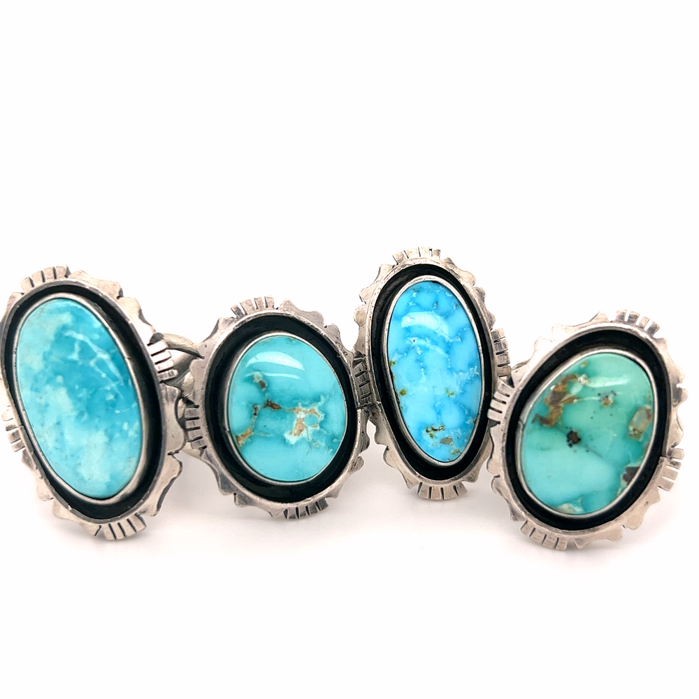 Three Stunning Native American Turquoise Rings with turquoise stones, inspired by Native American artistry.