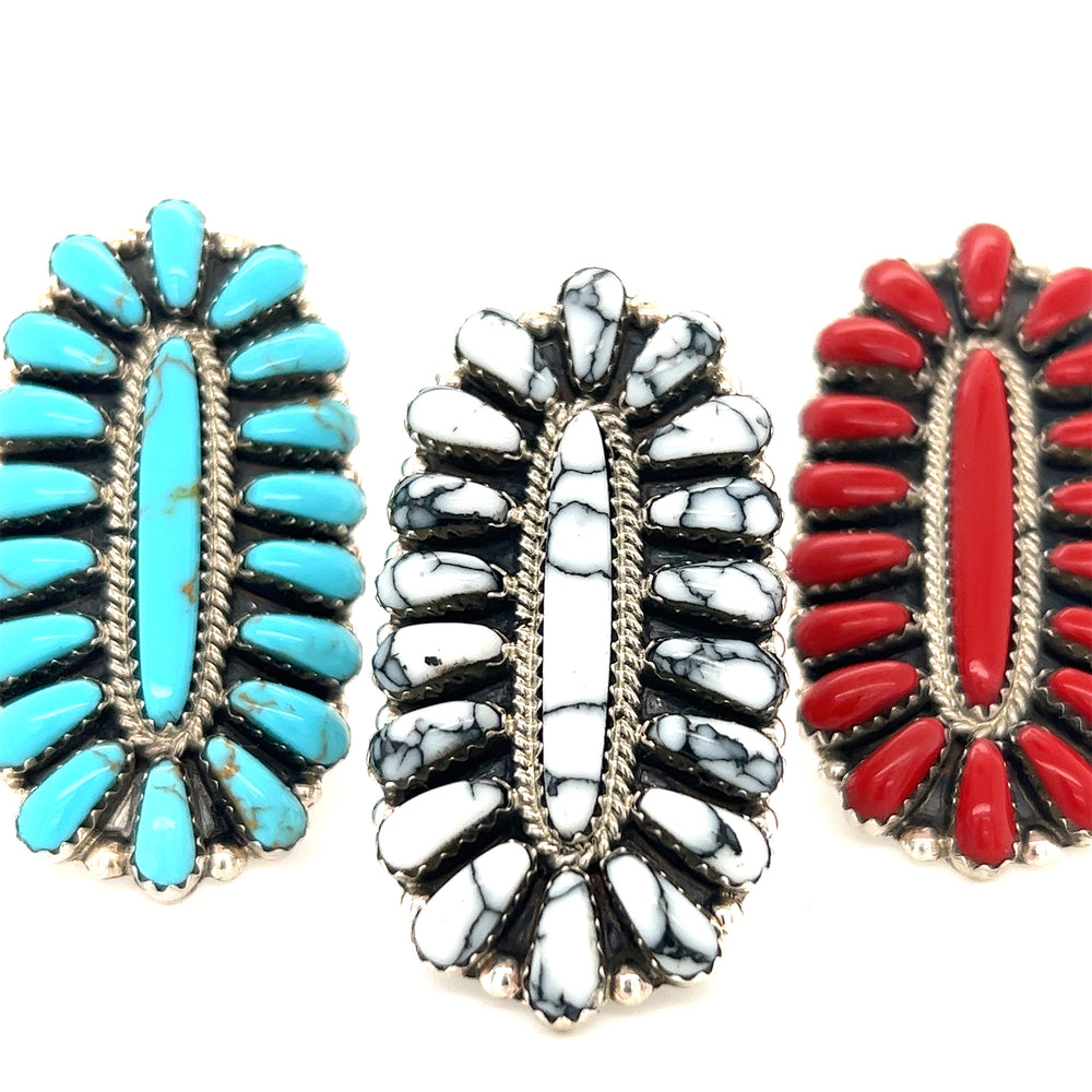 
                  
                    Three Gorgeous Fantail Native American rings with red, blue and white stones.
                  
                