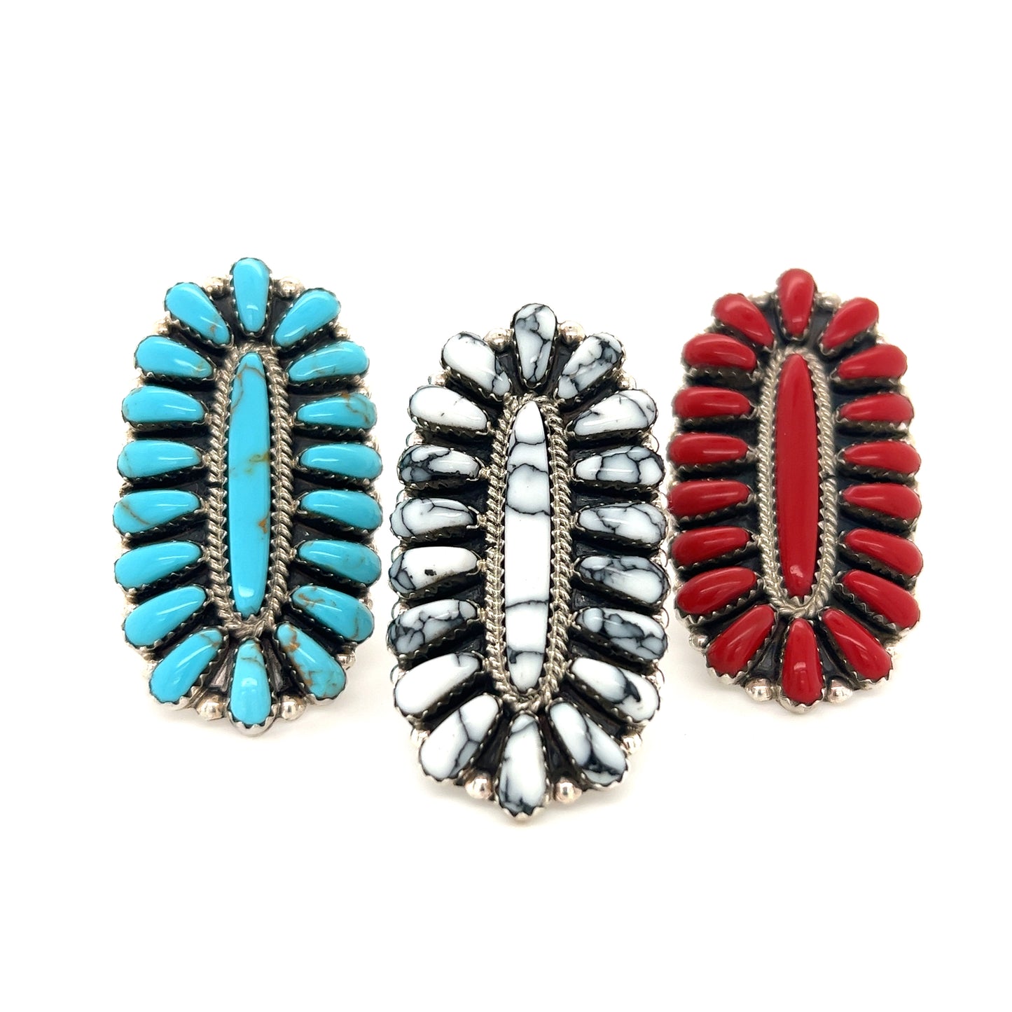 
                  
                    Three Gorgeous Fantail Native American Rings with red, blue, and black stones.
                  
                