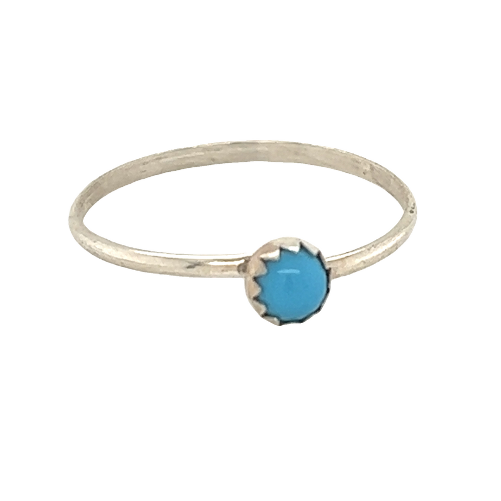 
                  
                    A Tiny Handcrafted Turquoise Ring with a sterling silver stone.
                  
                