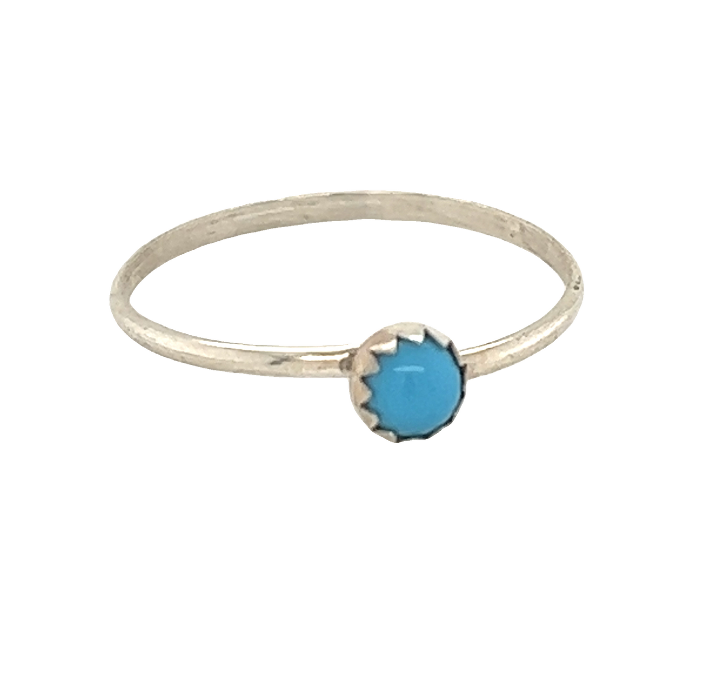 A Tiny Handcrafted Turquoise Ring with a sterling silver stone.
