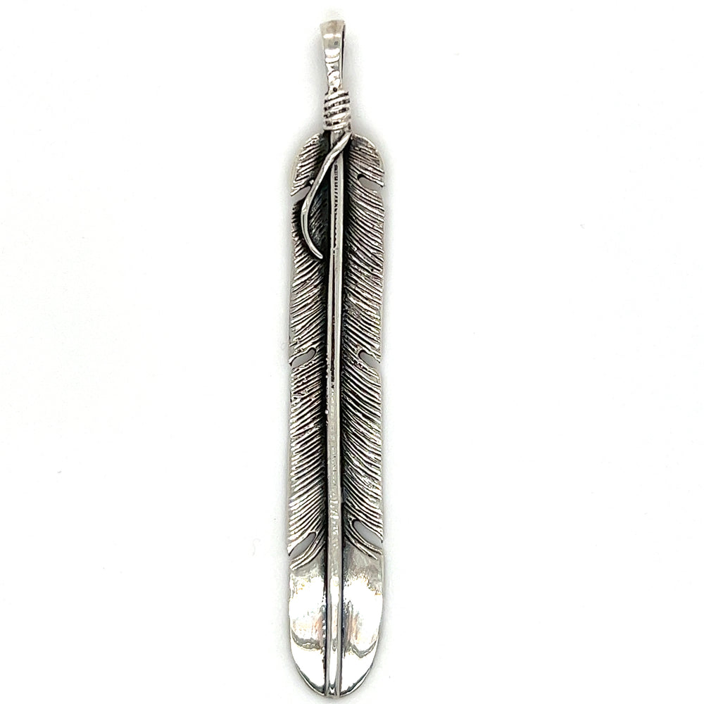 A Super Silver Long Rustic Feather Pendant on a white background with a rustic southwest bohemian vibe.