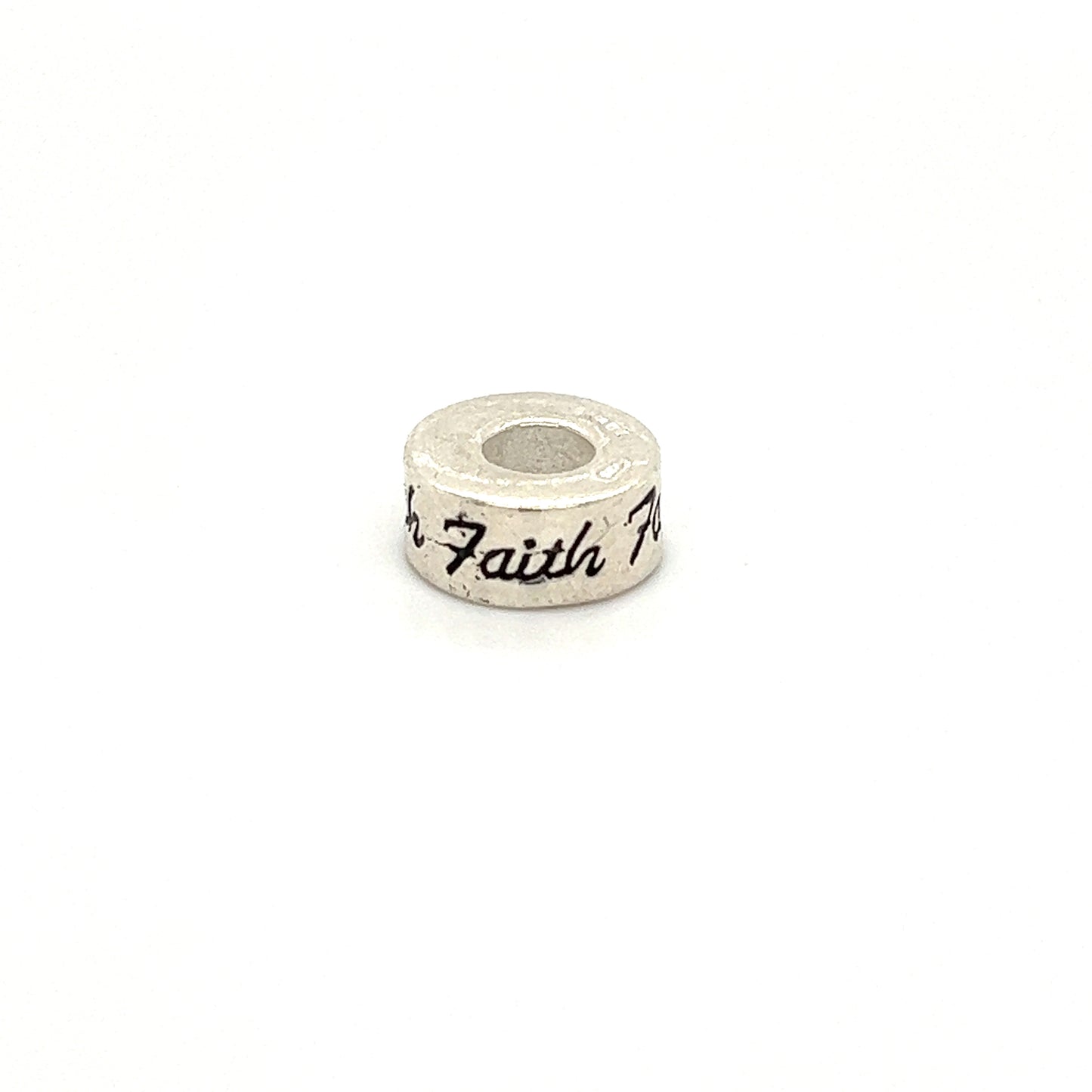 
                  
                    A Super Silver Affirmation Bead Charm with the word "faith" engraved on it.
                  
                