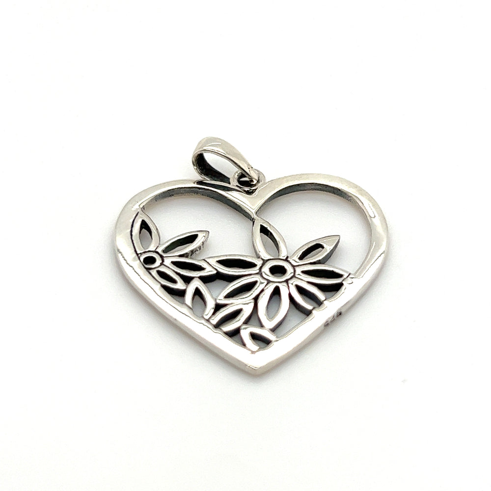 A Super Silver Heart Pendant with Flowers featuring exquisite flower detailing.