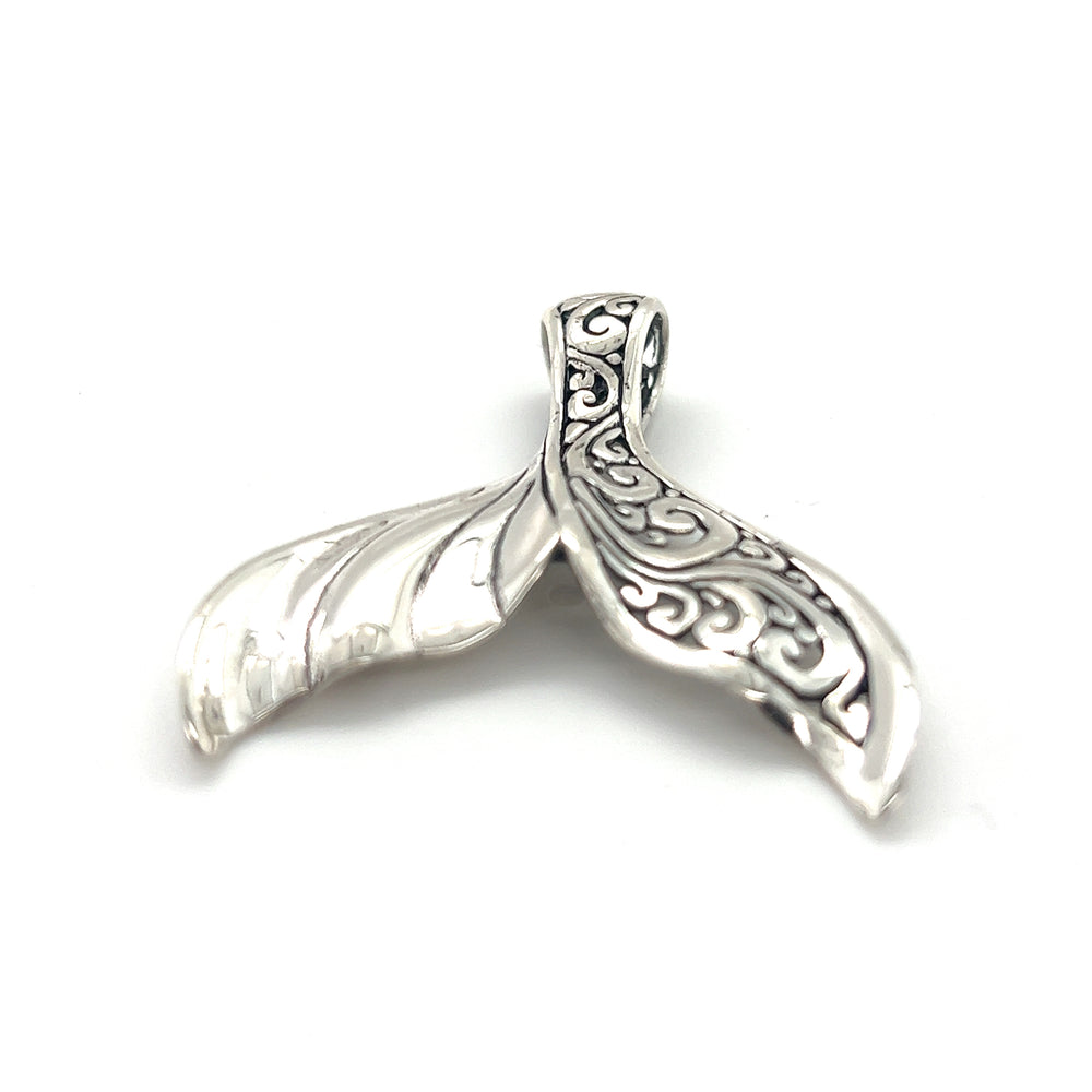 
                  
                    An Exceptional Half Filigree Whale Tail Pendant by Super Silver on a white background in Santa Cruz.
                  
                