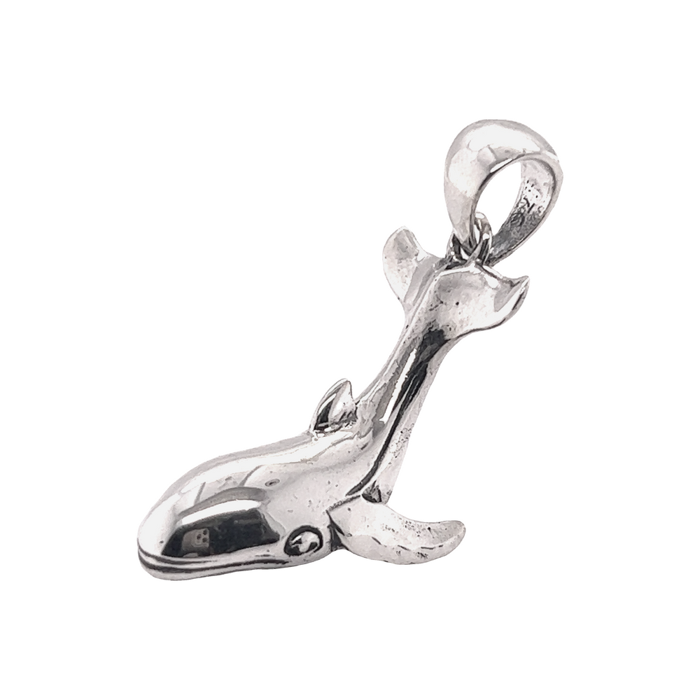 A Serene Whale Pendant by Super Silver on a white background, reminiscent of the ocean.