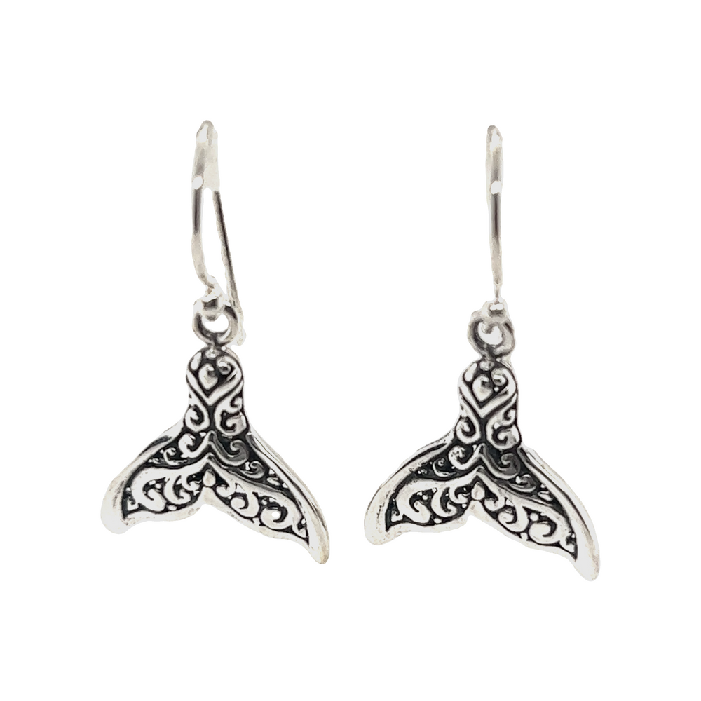 
                  
                    A pair of Enchanting Filigree Whale Tail Earrings by Super Silver.
                  
                