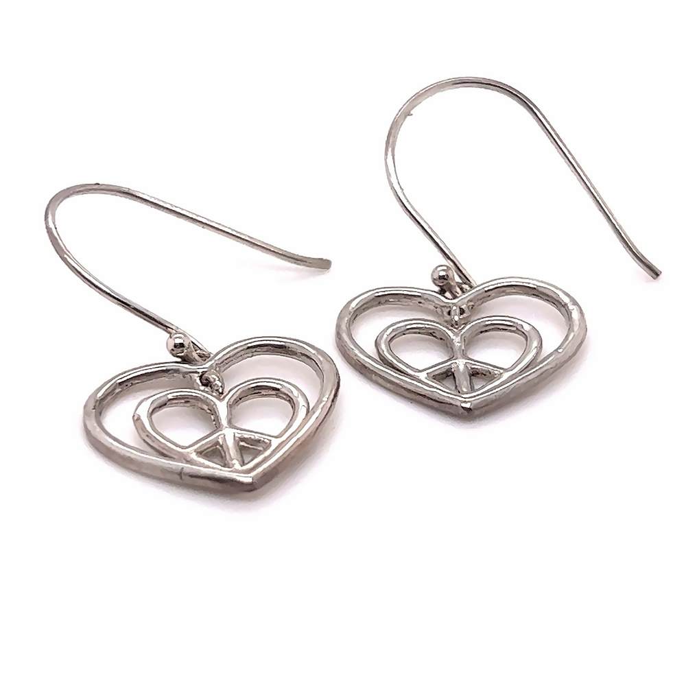 
                  
                    Super Silver's Hearts With Peace Signs Earrings made of .925 silver on a white background.
                  
                