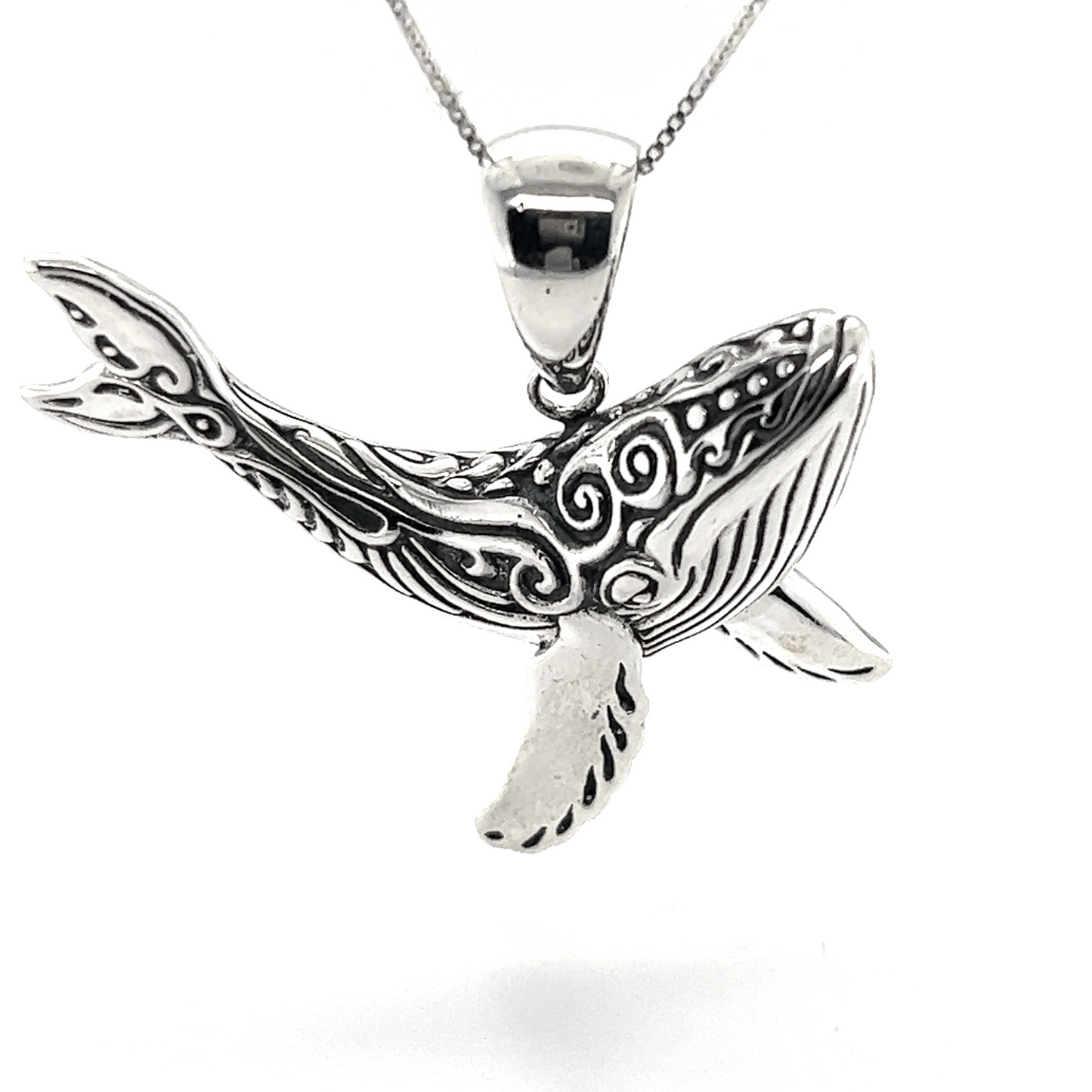 A stunning whale pendant from Super Silver, inspired by the Santa Cruz ocean, on a chain.
