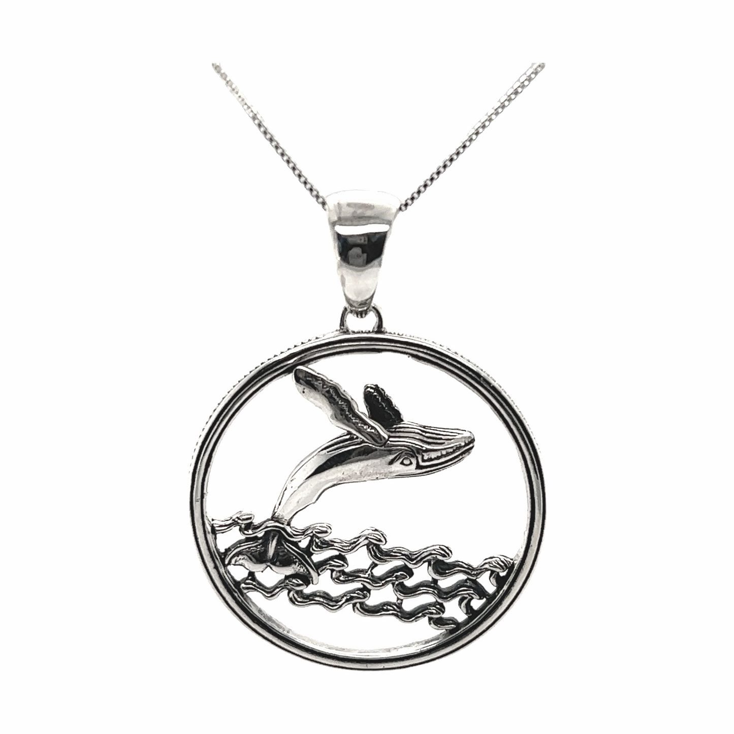 
                  
                    A Brilliant Whale Pendant by Super Silver, jumping out of the ocean waters near Santa Cruz.
                  
                