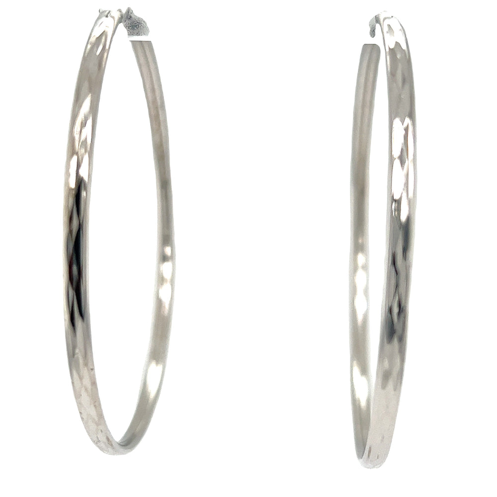 A pair of Flashy 60mm Diamond Faceted Hoops by Super Silver on a white background.