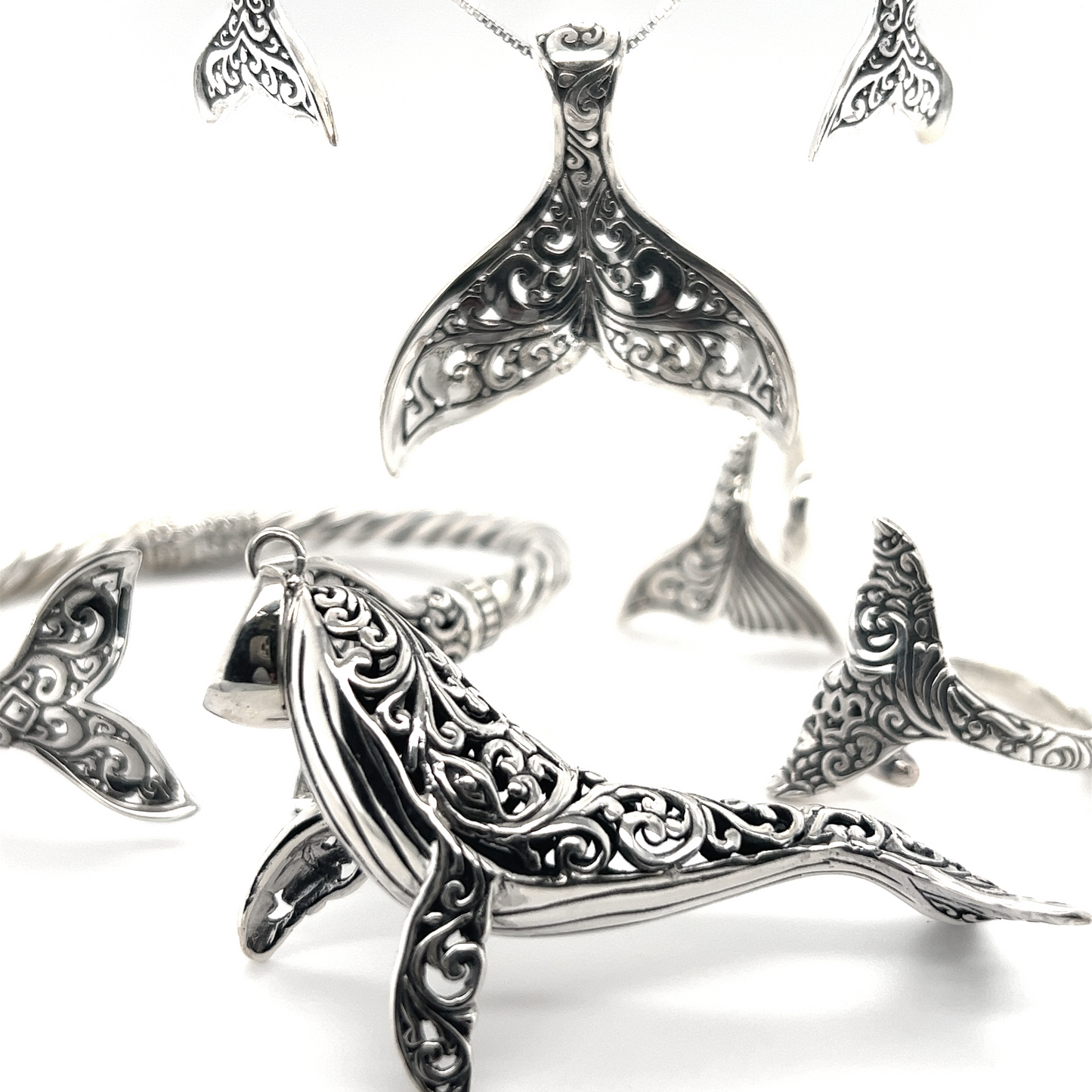 
                  
                    A set of Super Silver sterling silver jewelry featuring the Magnificent Filigree Whale Pendant, inspired by the ocean and Santa Cruz.
                  
                