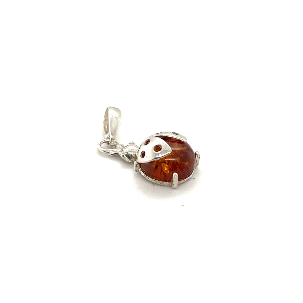 
                  
                    A Super Silver Amber Ladybug Pendant, offering protection.
                  
                