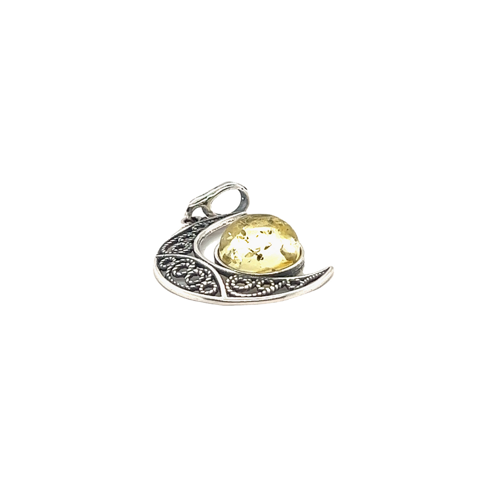 
                  
                    A Stunning Filigree Amber Moon Pendant with a crescent moon and a citrine stone by Super Silver.
                  
                
