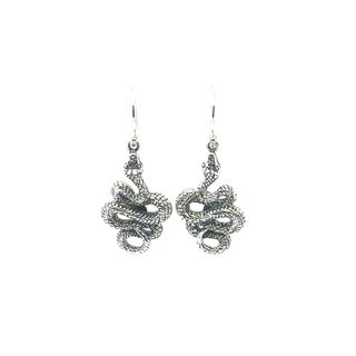 A pair of Alluring Snake Earrings by Super Silver on a white background.