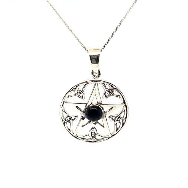 A spellbinding Super Silver pentagram pendant adorned with a captivating onyx stone.