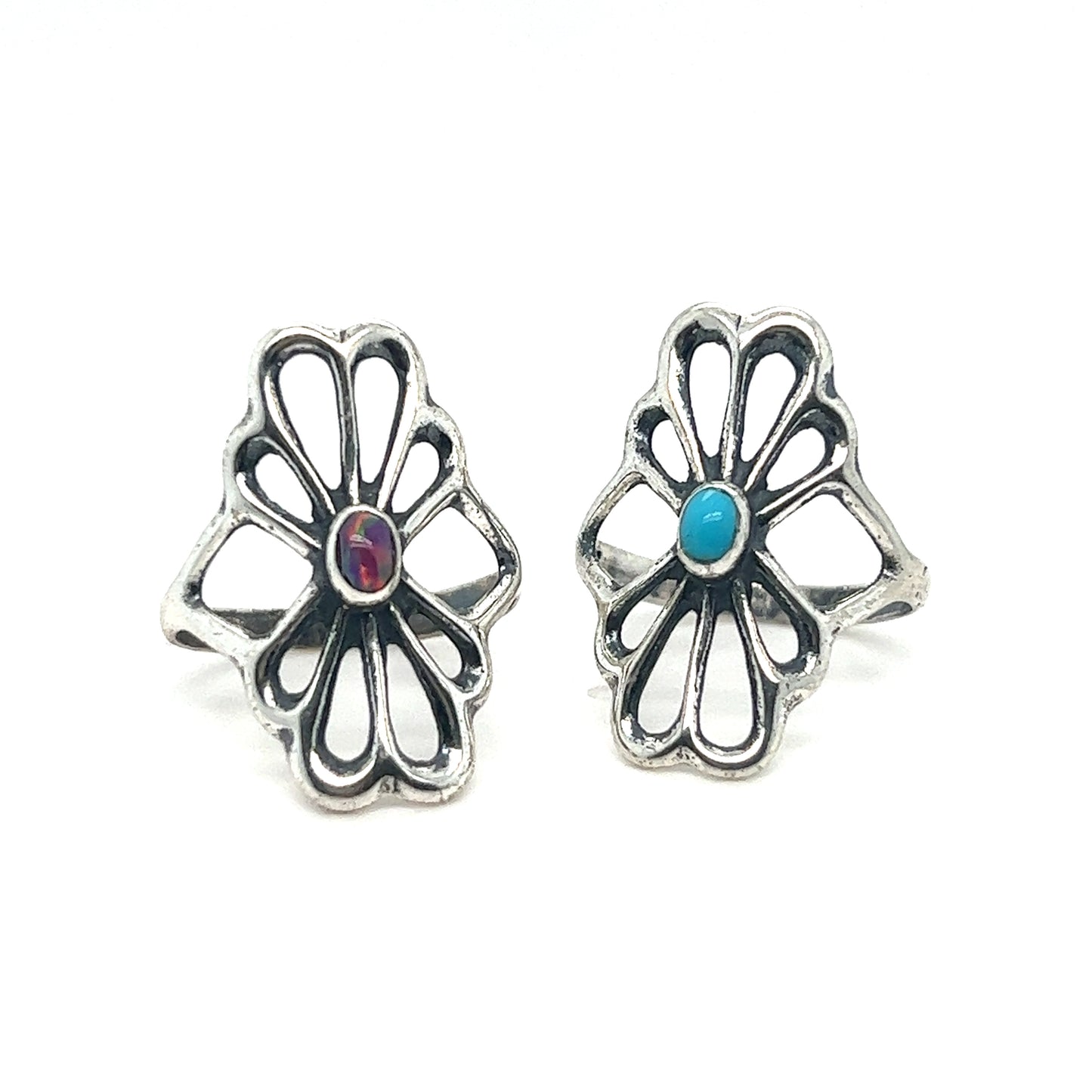 A pair of handcrafted Super Silver American Made Flower Rings with oval turquoise stones.