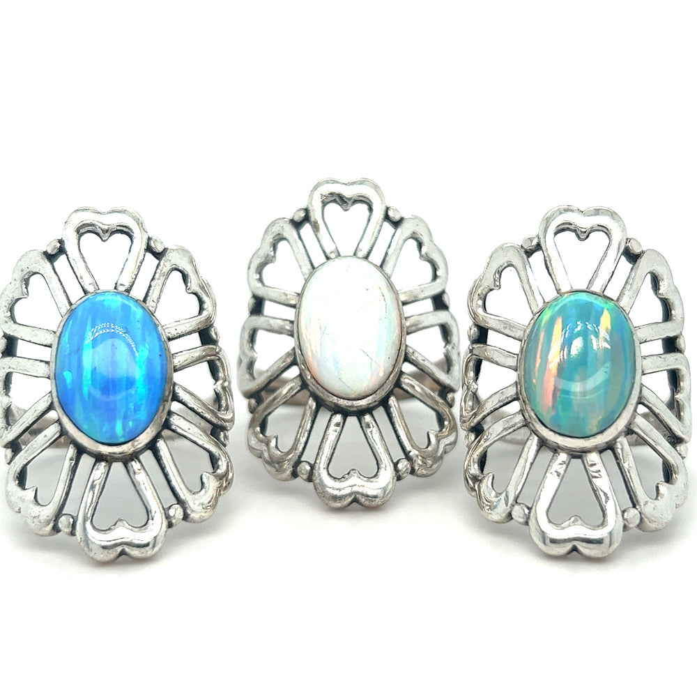 Super Silver's American Made Opal Flower Ring with Heart Shaped Petals features handcrafted silver rings embedded with opal stones.