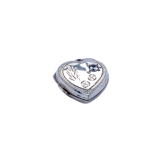 
                  
                    A Super Silver Heart Shaped Locket with Stone and lacy Etching on a white background.
                  
                