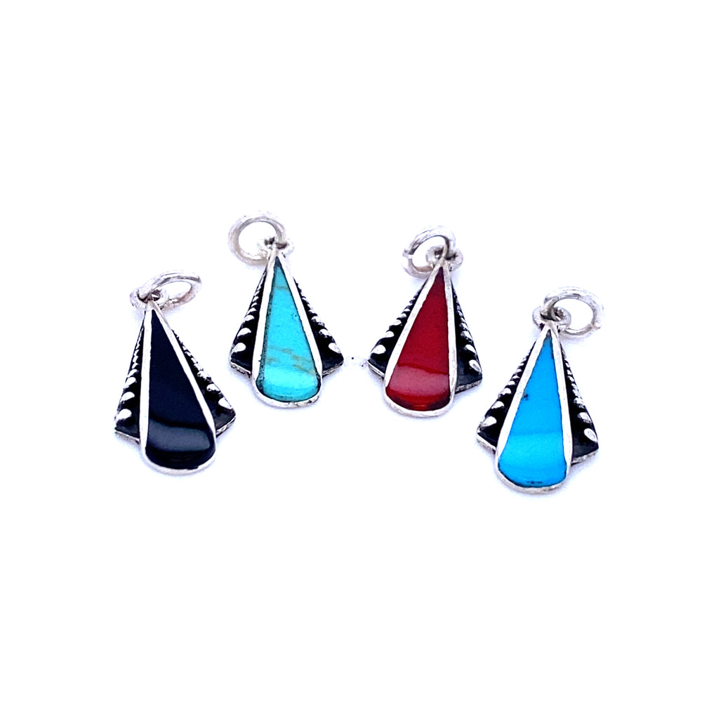 A set of four Super Silver Teardrop Pendants with Inlaid Stones and Ball Border, inlaid with turquoise, red, and black stones.