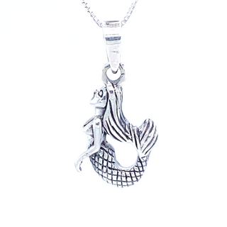 A mesmerizing Small Majestic Mermaid Pendant from Super Silver adorns a delicate chain, creating an enchanting necklace perfect for any ocean lover.