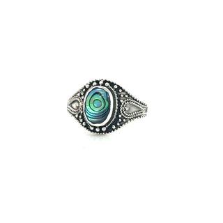 
                  
                    An oxidized silver Vintage Style Oval Shield Ring with inlaid blue and green stones.
                  
                