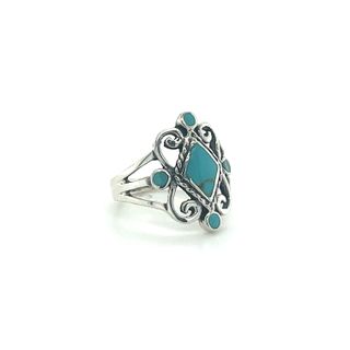 
                  
                    A Victorian style inlay ring featuring a blue stone, crafted from Sterling Silver.
                  
                