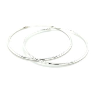 Placed on a white background are two elegant 1.2mm Infinity Hoops, beautifully crafted in .925 Sterling Silver and showcasing their sleek design.