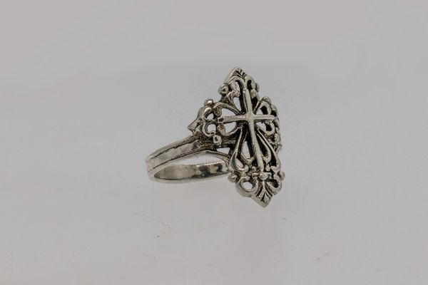 An ornate Super Silver ring with a detailed Cross with Cutout Filigree design.