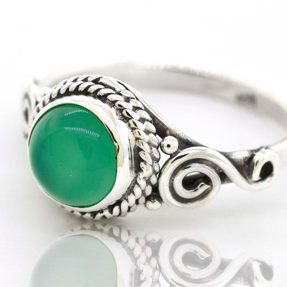 
                  
                    A Super Silver Gemstone Circle Ring With Rope Border And Swirl Design, exuding a bohemian vibe.
                  
                