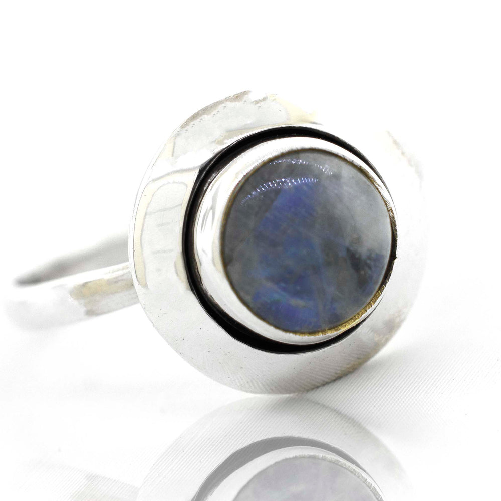 
                  
                    This contemporary Round Gemstone Ring With Oxidized Outline from Super Silver showcases a minimalist design with a stunning blue labradorite stone.
                  
                