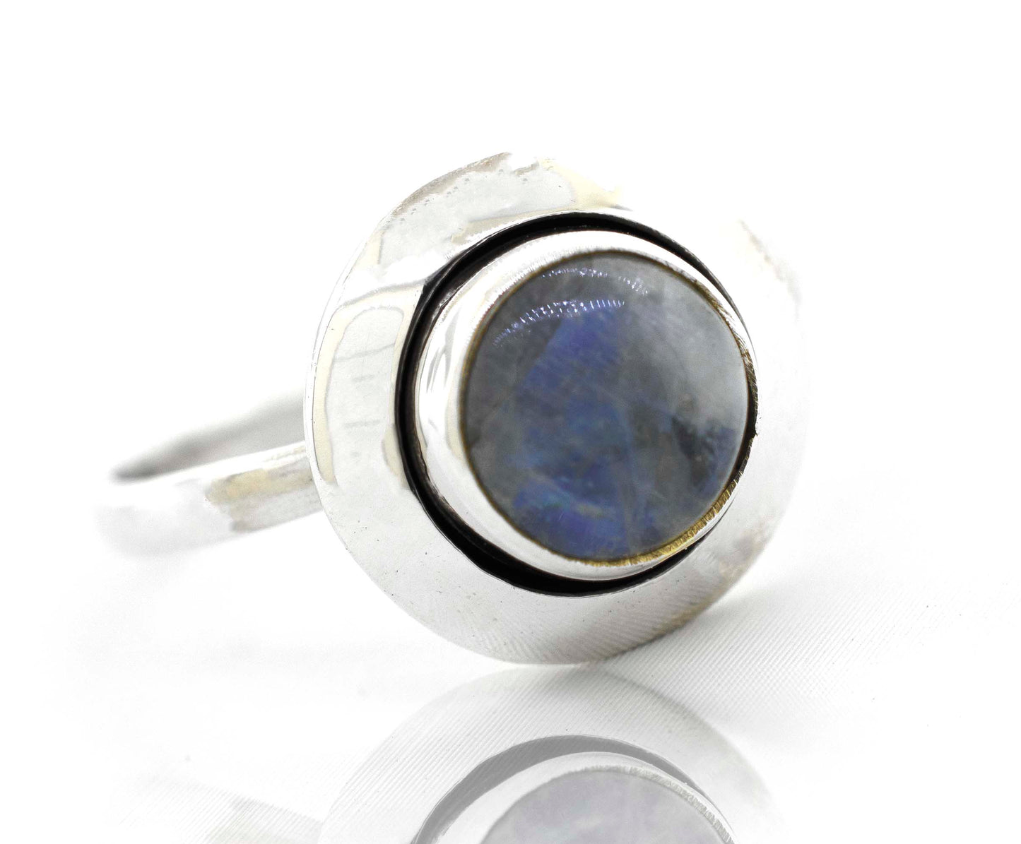
                  
                    This contemporary Round Gemstone Ring With Oxidized Outline from Super Silver showcases a minimalist design with a stunning blue labradorite stone.
                  
                