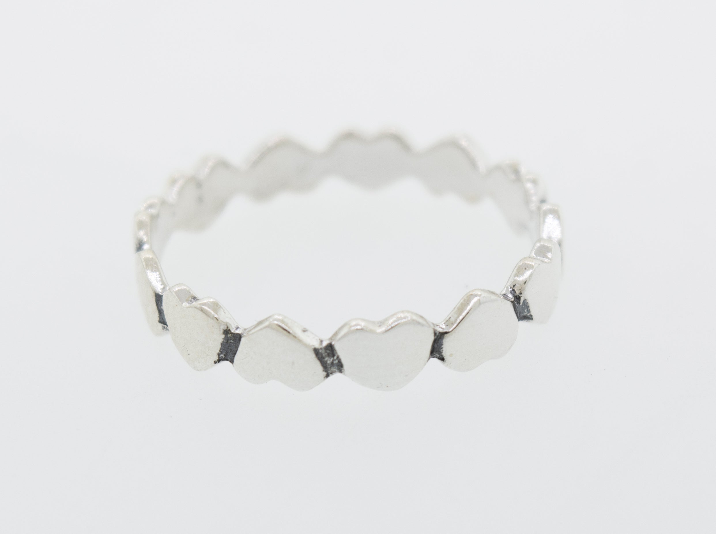 A sterling silver ring with Hearts Band With Alternating Pattern perfect for stacking.