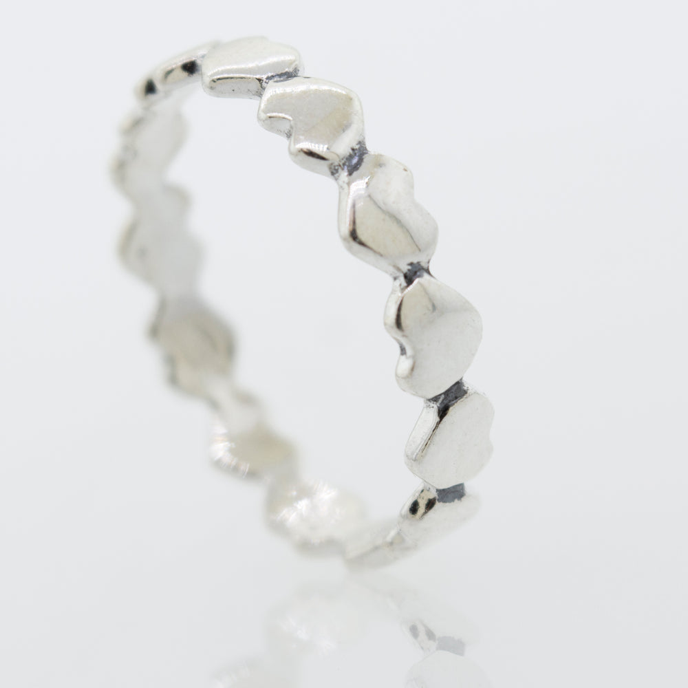 
                  
                    A sterling silver Hearts Band With Alternating Pattern.
                  
                