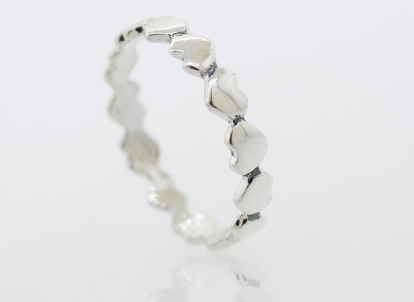 
                  
                    A sterling silver Hearts Band With Alternating Pattern.
                  
                