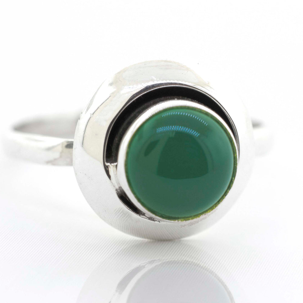 
                  
                    A contemporary Round Gemstone Ring With Oxidized Outline, crafted from sterling silver and featuring a striking green stone, by Super Silver.
                  
                