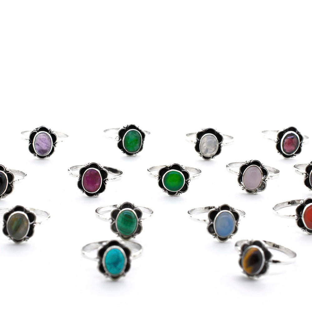 A group of Gemstone Rings With Oxidized Flower Design on a white background.