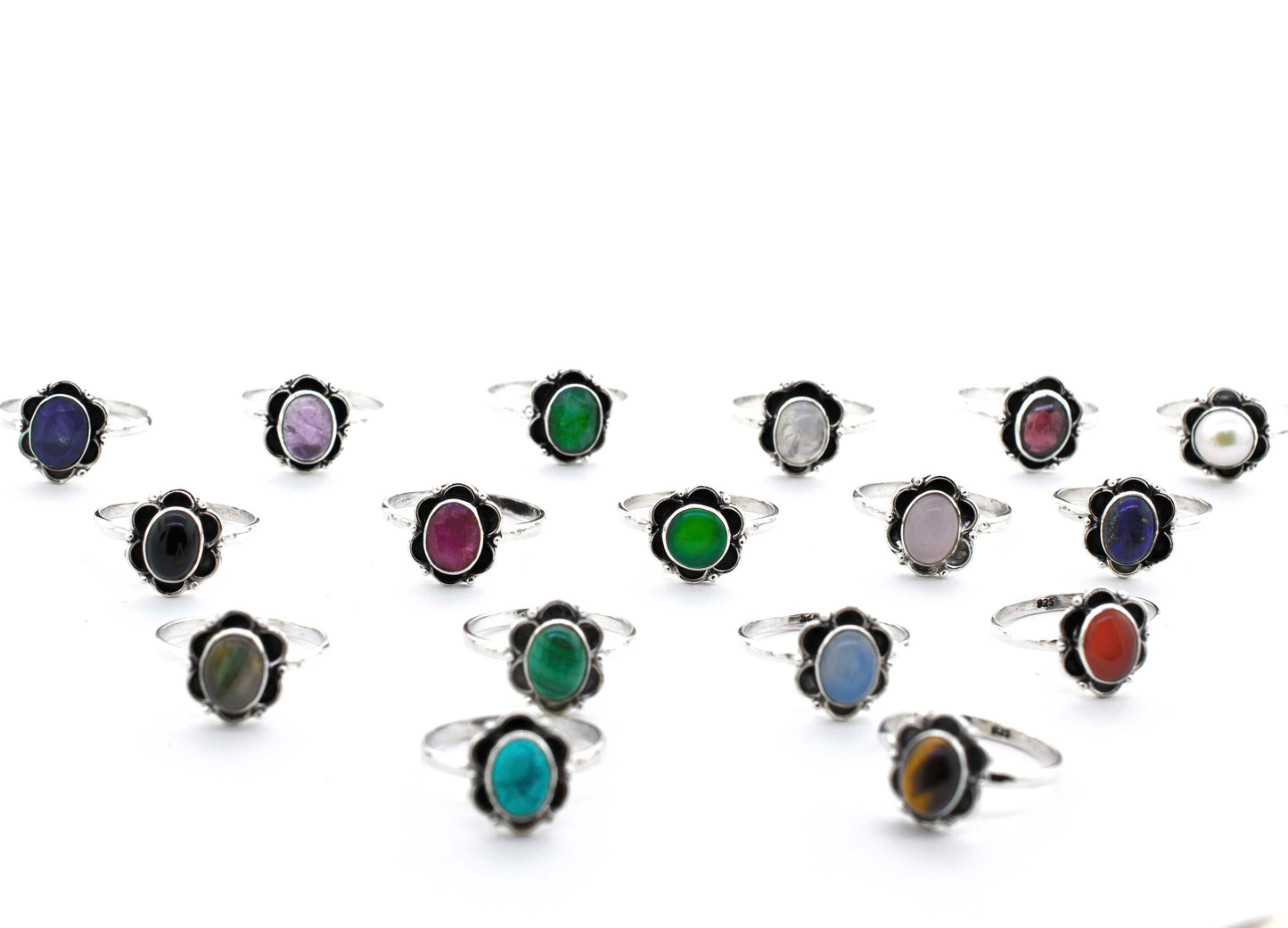 A group of Gemstone Rings With Oxidized Flower Design on a white background.