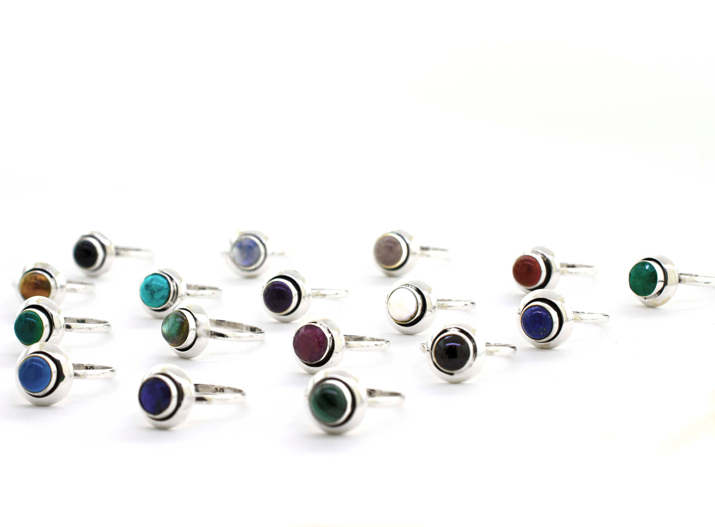 A Round Gemstone Ring With Oxidized Outline featuring cabochon stones in various vibrant colors.