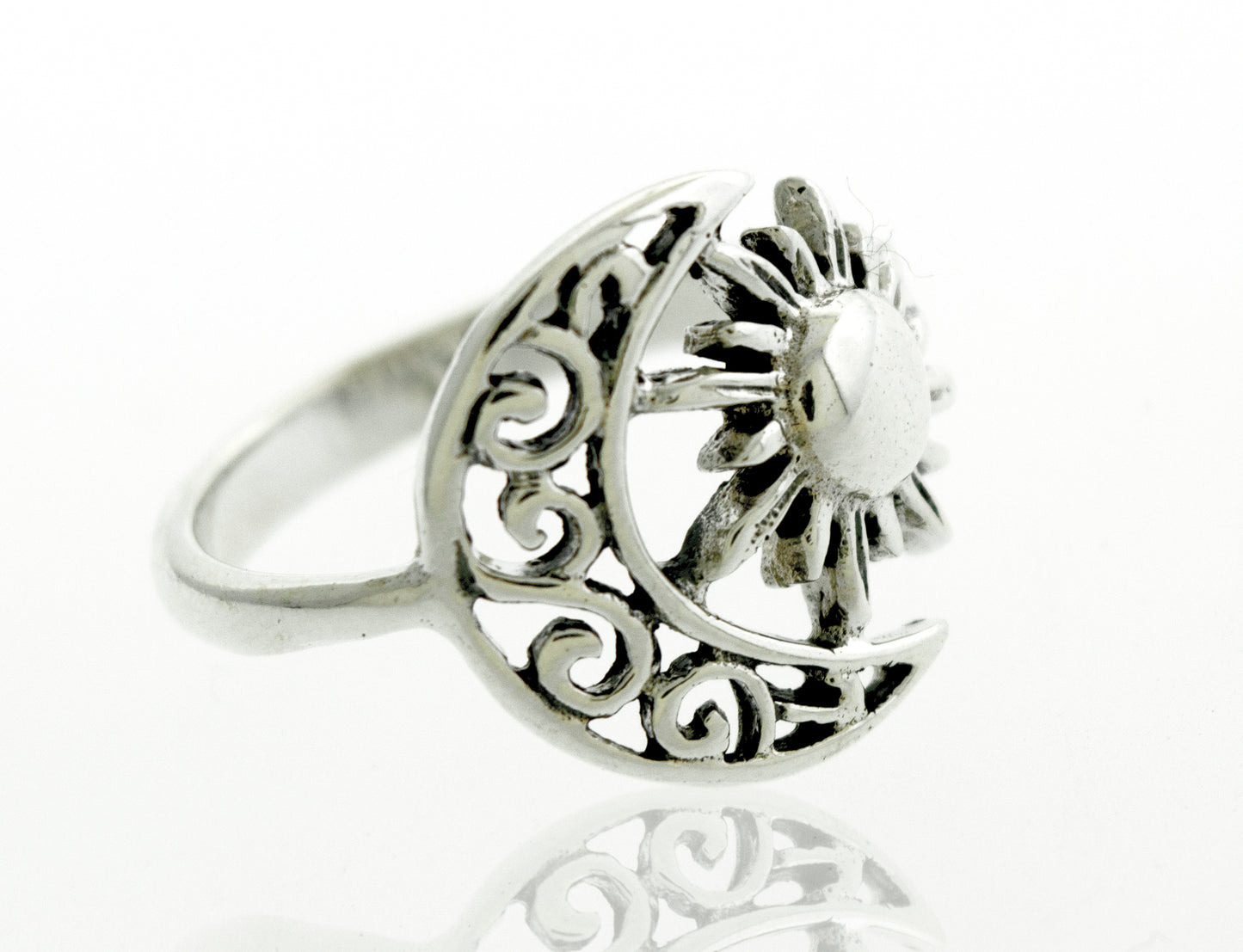 A Moon And Sun Ring With Swirl Design adorned with a celestial moon and sun design.