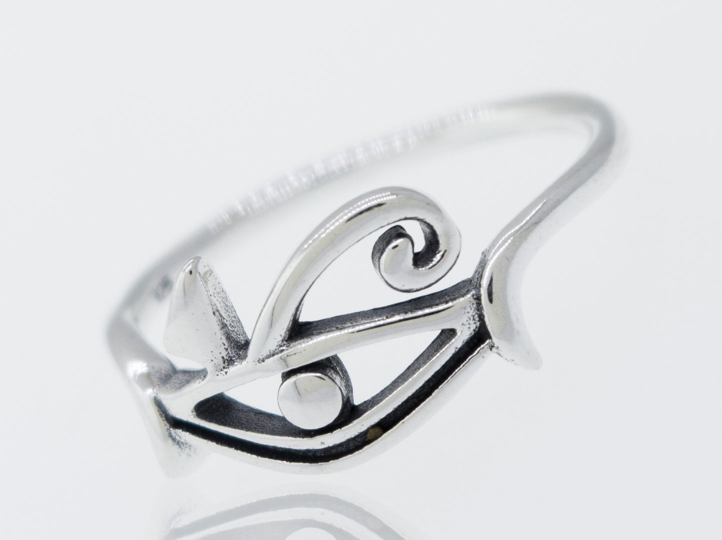 
                  
                    An Eye of Horus Ring on a white surface.
                  
                