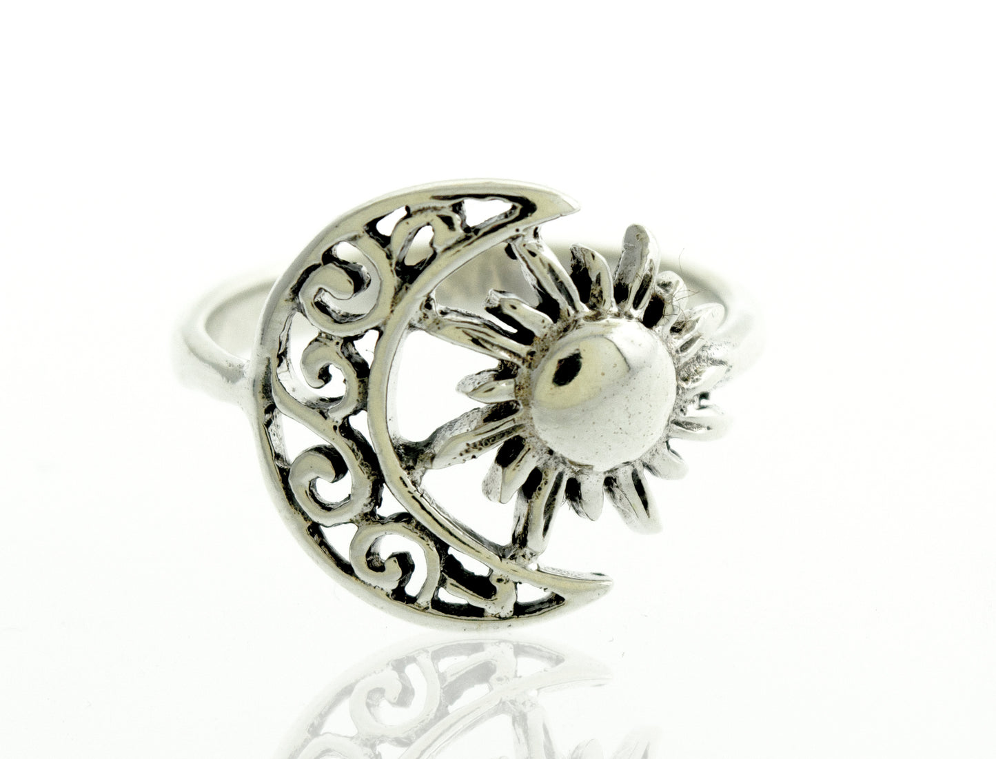A Moon And Sun ring with a swirl design.