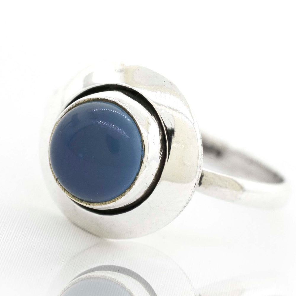 
                  
                    A boho-inspired Round Gemstone Ring With Oxidized Outline adorned with a stunning blue stone.
                  
                