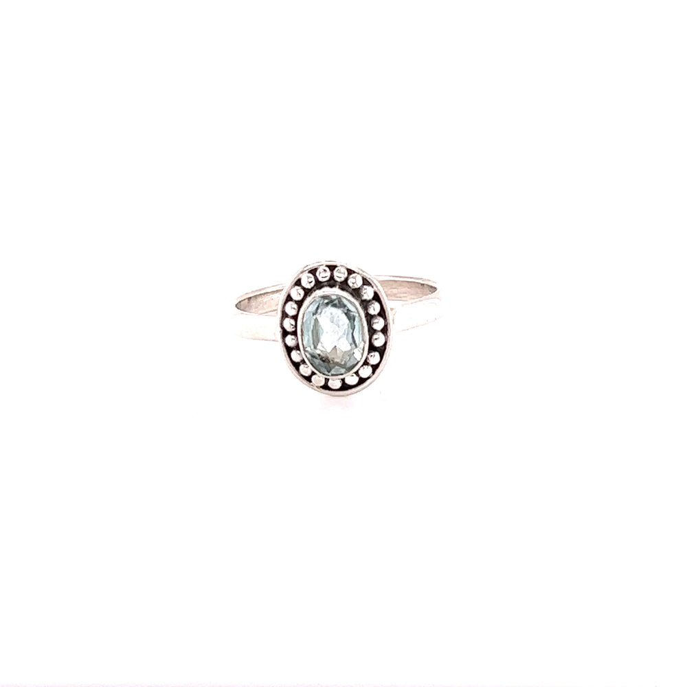 
                  
                    A oval gemstone ring with ball disk border.
                  
                