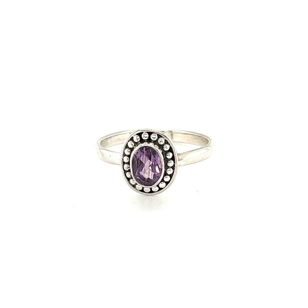 
                  
                    Oval Gemstone Ring with Ball Disk Border in sterling silver, perfect for the hippie at heart.
                  
                