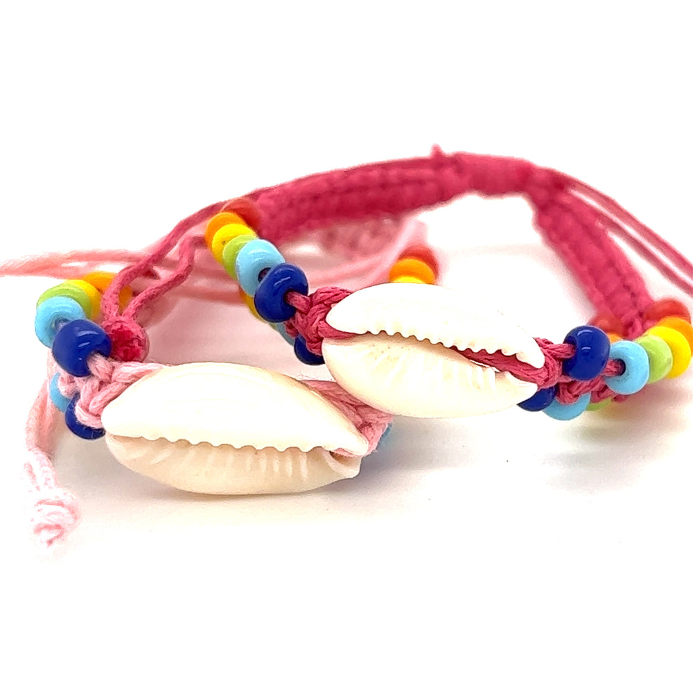 
                  
                    Two Super Silver Cowrie Shell Braided Bracelets with rainbow beads on an adjustable band.
                  
                